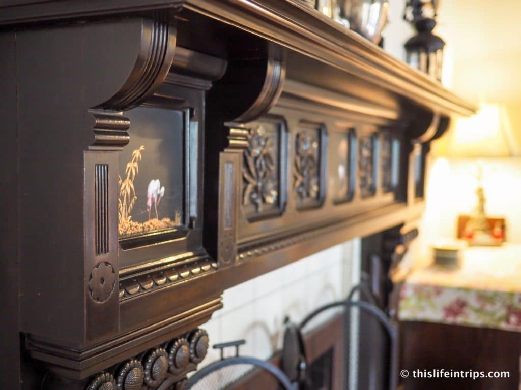 Intricate wood carvings in the fireplace at Hochelaga Inn