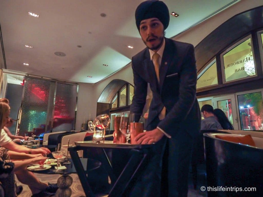 Server from the hotel preparing our cocktail
