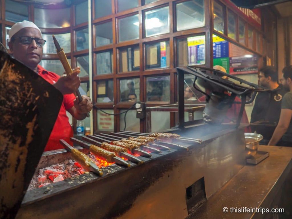 Exploring Delhi's street food scene with succulent kebabs and flavorful curries.
