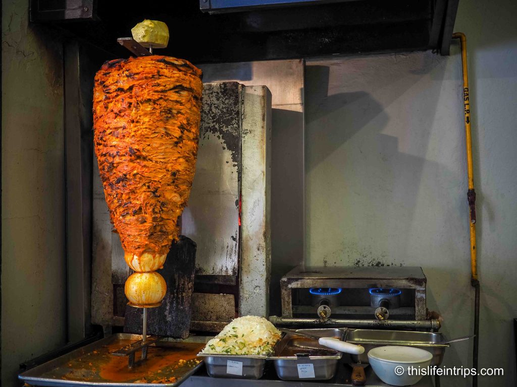 Tasting the delicious tacos at El Tizoncito