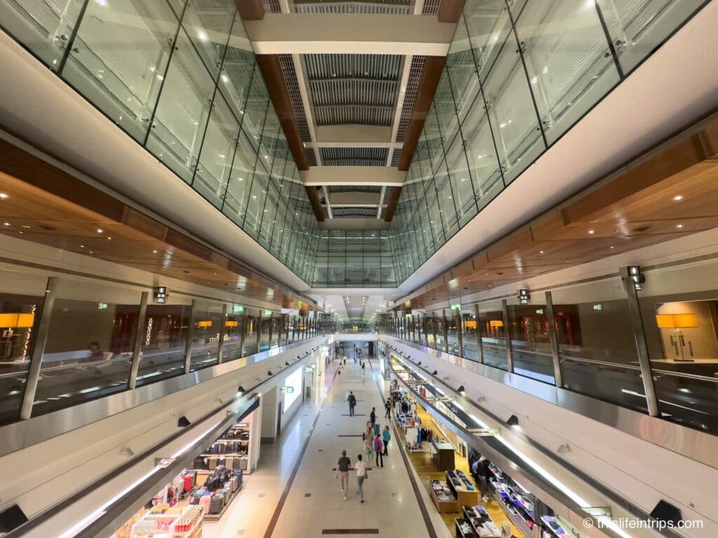 View of the terminal below from the 2nd level DXB Emirates Business Class Lounge