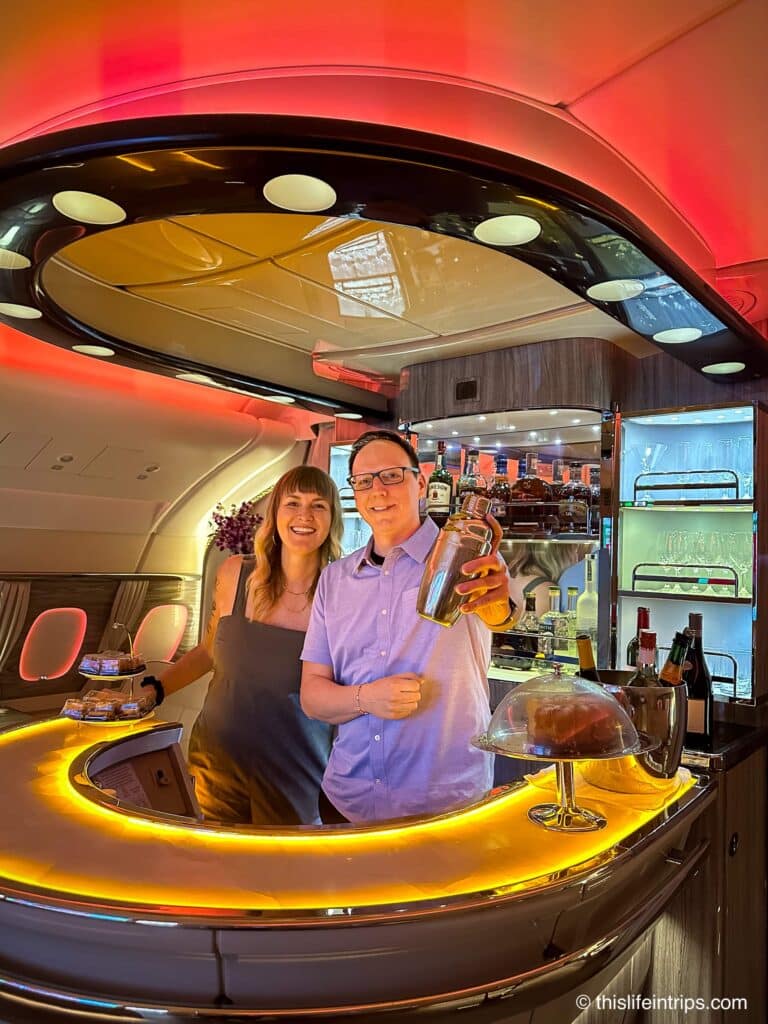 behind the Emirates a380 business class bar making cocktails