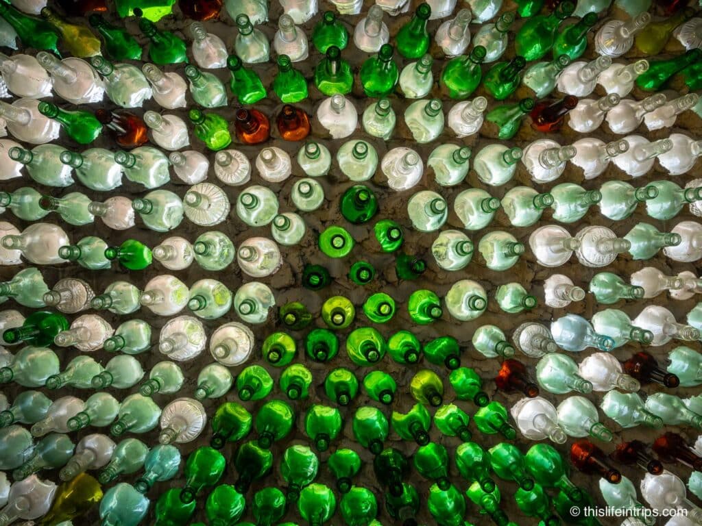 a wall of the pei glass bottle house
