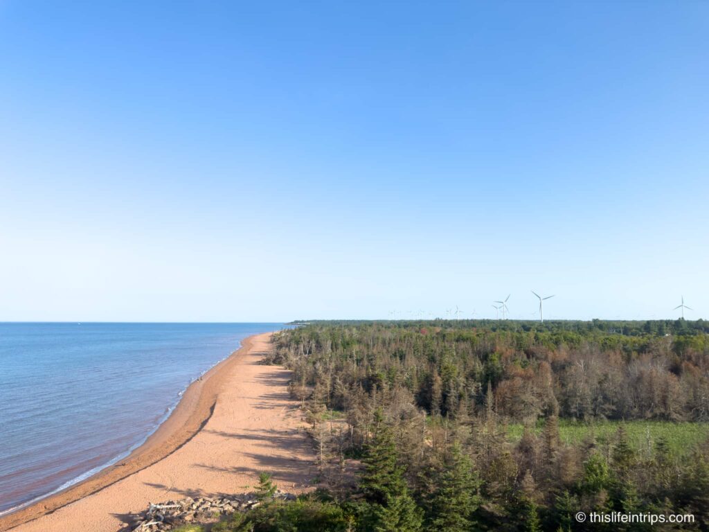 Daytime view at the top of the  West Point Lighthouse with windmills in the distance