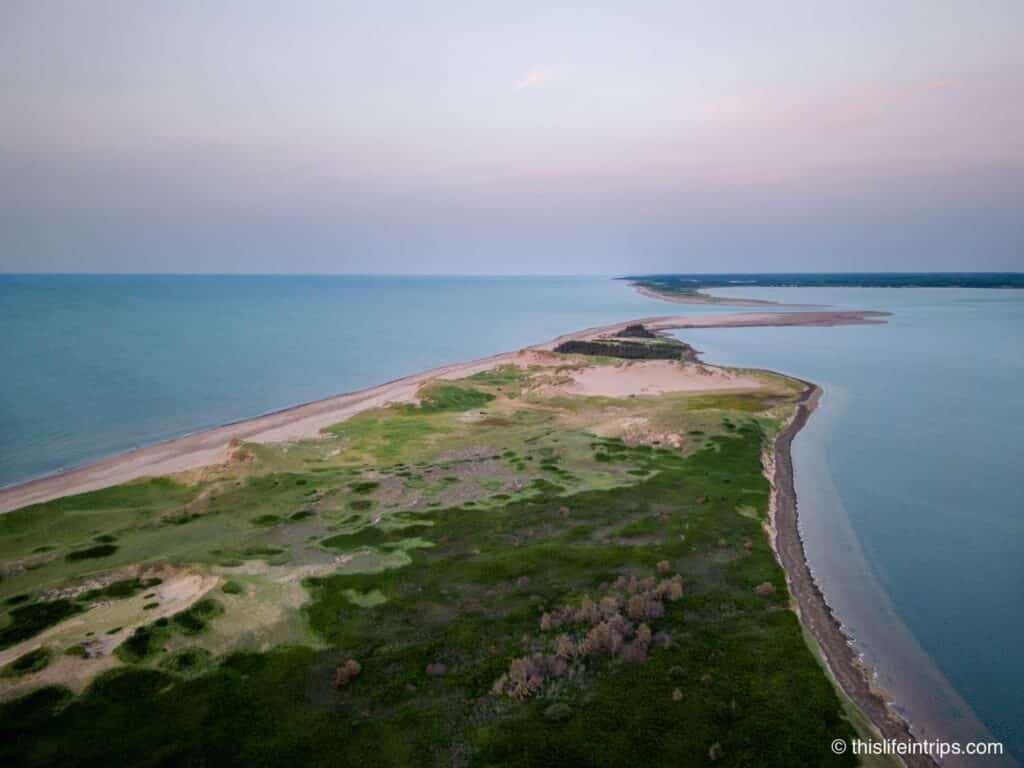 Arial shot of the pink sandy beaches in PEI. A unique things to do in PEI.