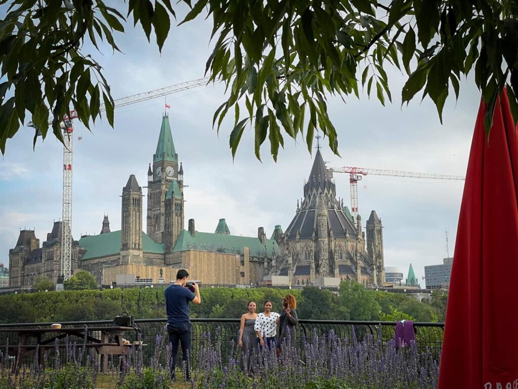 Parliament Hill with Canadian flag flying high