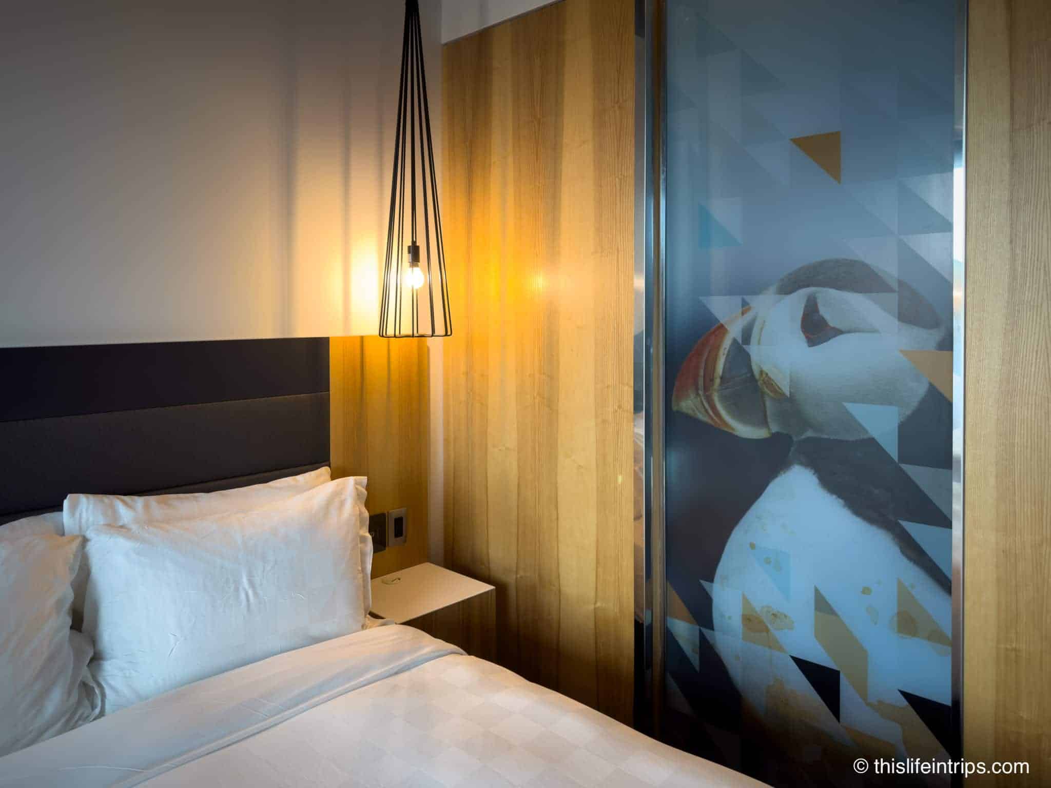 Room at the Alt Hotel, St.John's with Puffin mural on glass shower separator