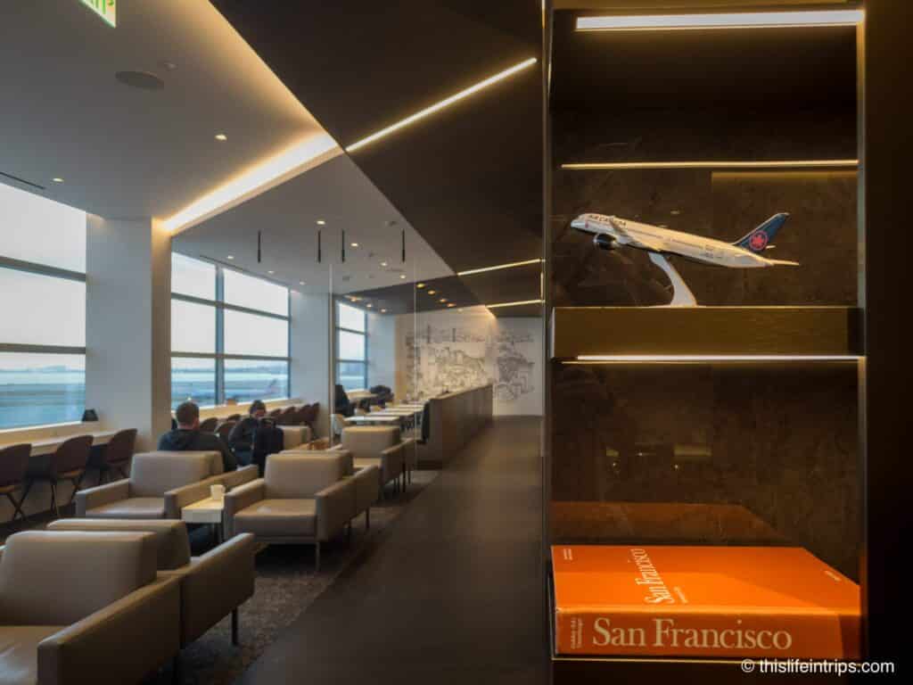 Entrance to the San Francisco Air Canada Lounge with model plan and book labeled San Francisco in the forground