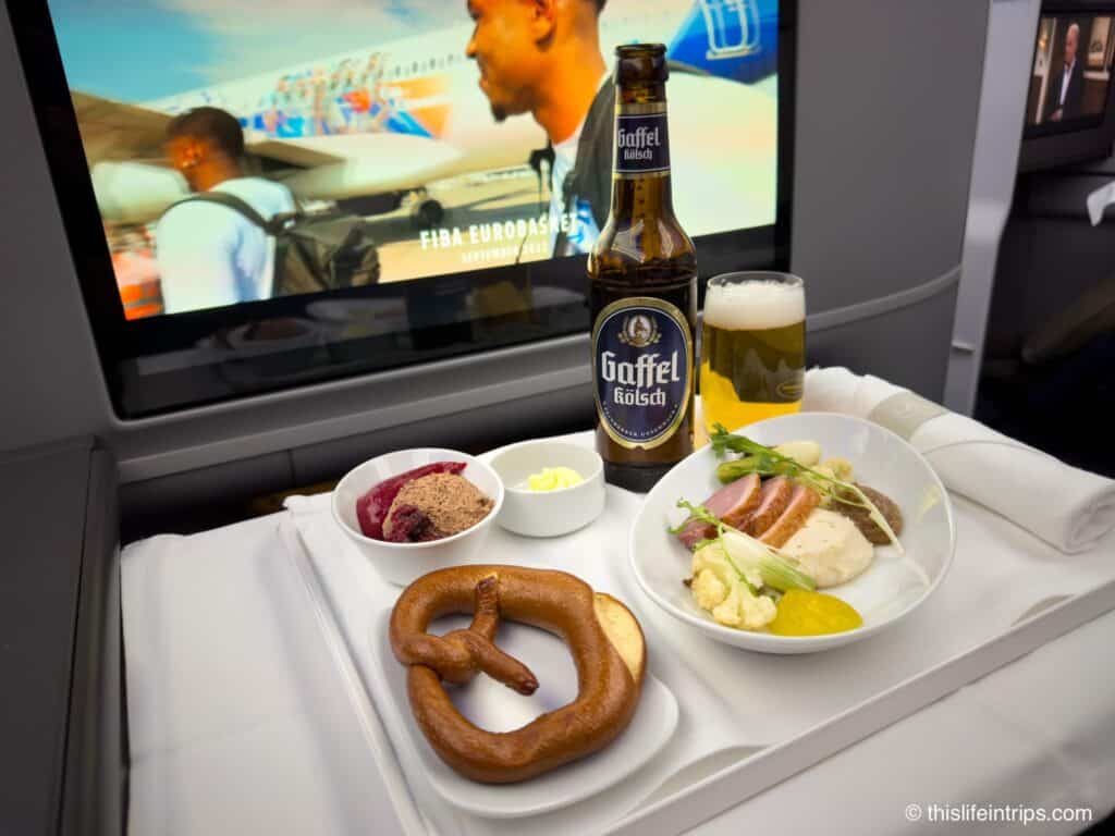Lufthansa Allegris business class meal - smoked duck with pretzel and German Kolsch beer