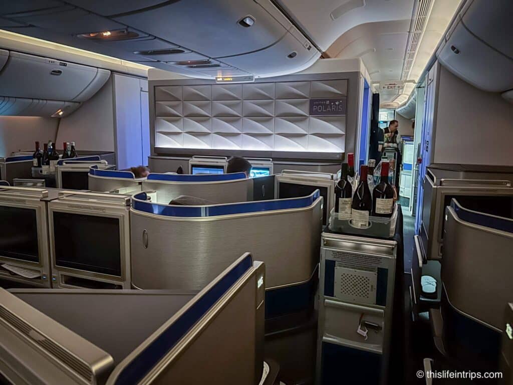 United Polaris business class with cart in the aisle