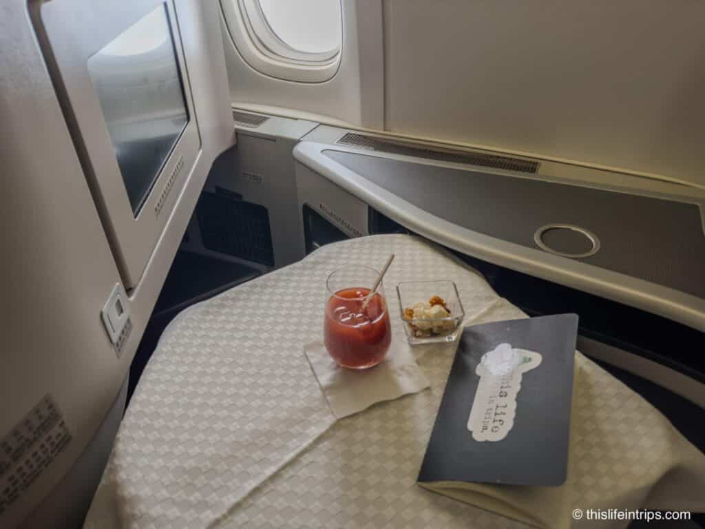 Bloody Mary on a table in EVA Business Class seat