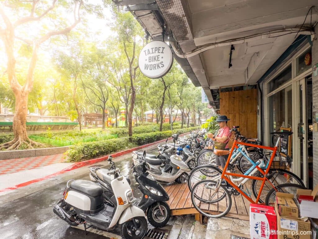 Taipei Bike Works shop entrance with bikes and scooters out front