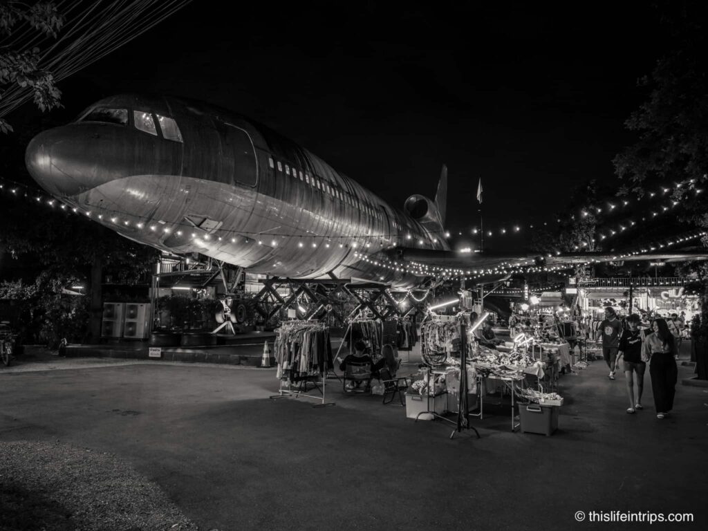 chang chui plane night market in black and white