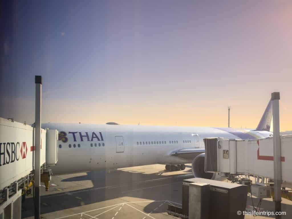 Boeing 777-300ER Thai Airways parked at gate at LHR airport