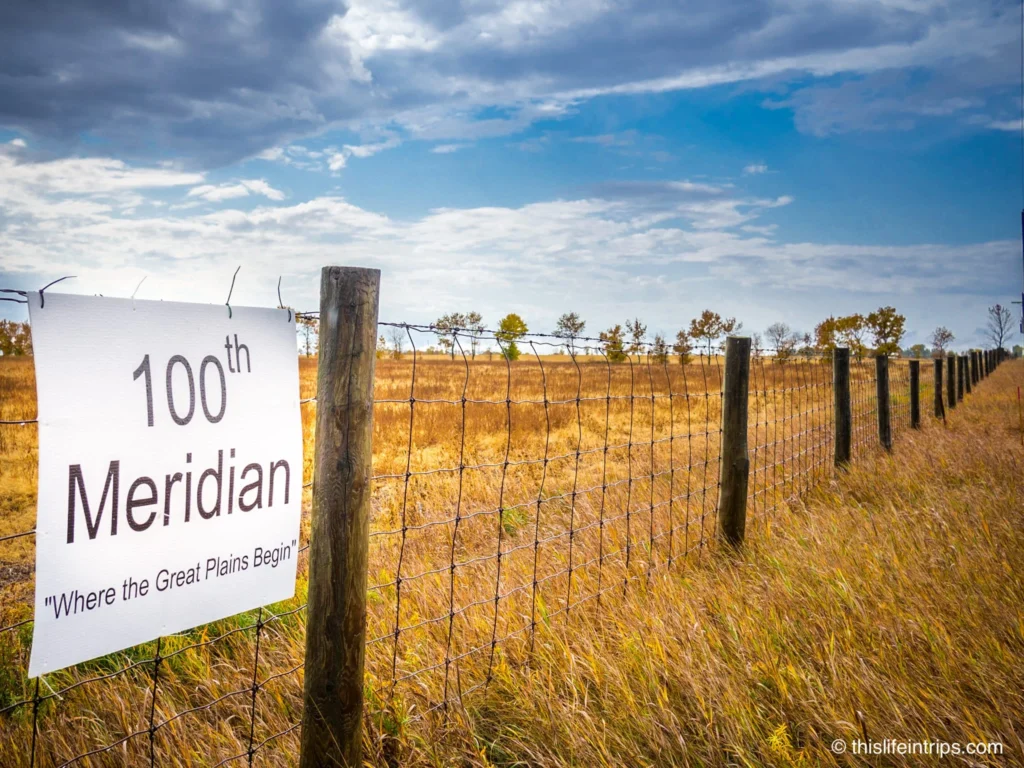 sign at the 100th Meridian, where the great plains begin. - Tragically Hip Travel Bucket List stop