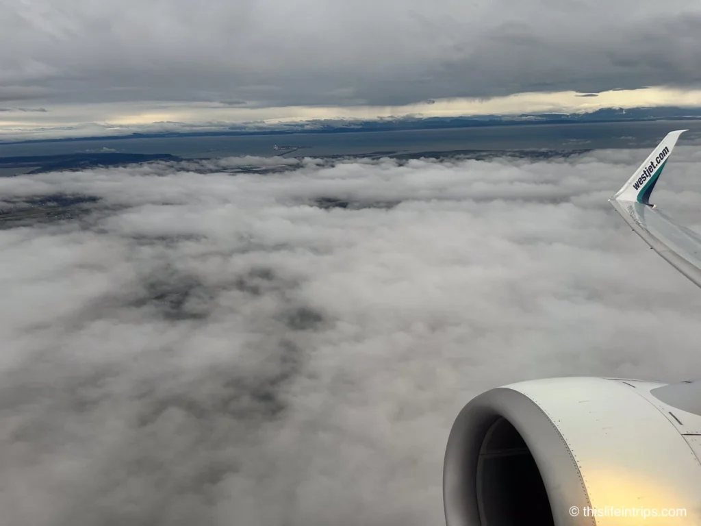 Westjet UltraBasic window seat views of overcast Vancouver