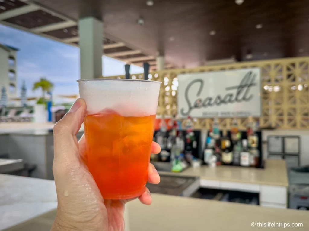 hand holding drink It's always happy hour at this Cancun Hilton resort